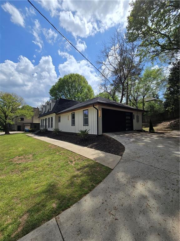 3832 Finger Creek Southwest Lilburn, GA 30047 - Photo 2 of 24 a front view of house with yard and trees in the background