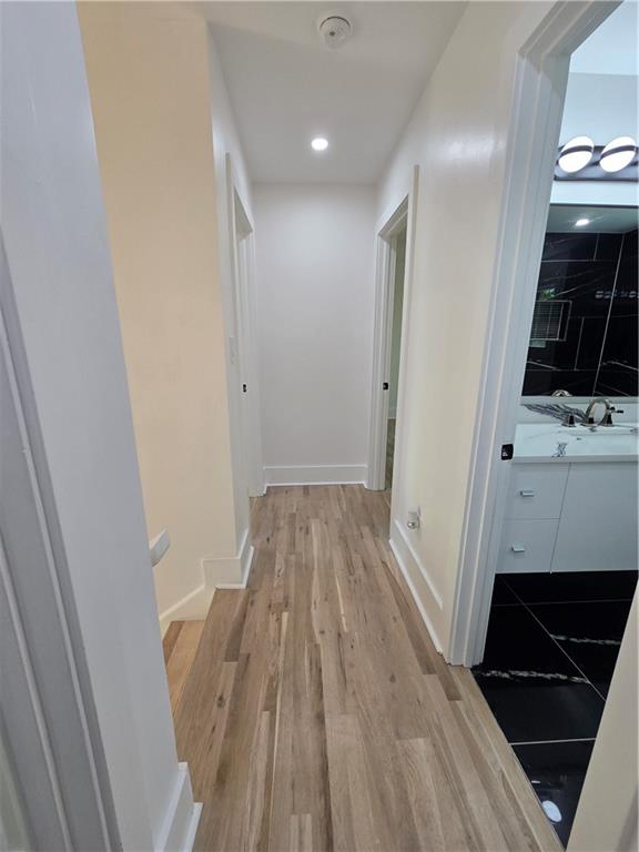 3832 Finger Creek Southwest Lilburn, GA 30047 - Photo 21 of 24 a view of a livingroom with wooden floor and staircase