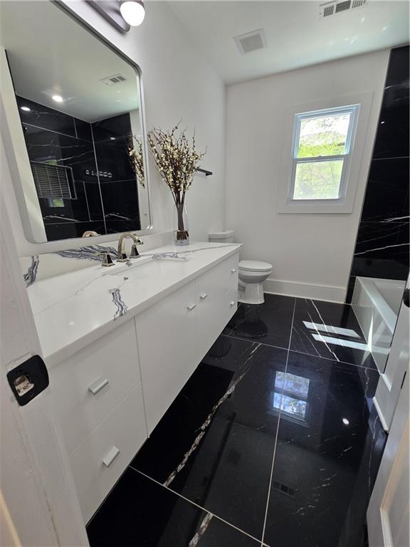 3832 Finger Creek Southwest Lilburn, GA 30047 - Photo 22 of 24 a bathroom with a double vanity sink and mirror