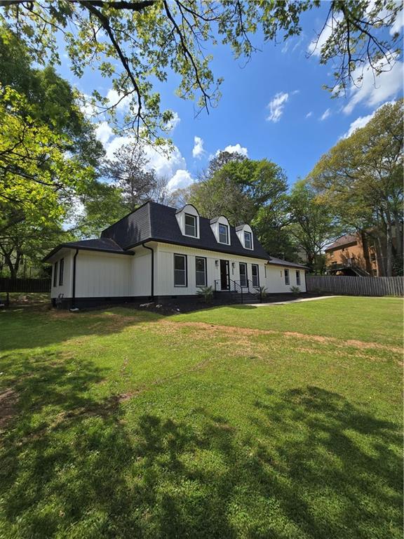 3832 Finger Creek Southwest Lilburn, GA 30047 - Photo 3 of 24 a view of a house with a backyard