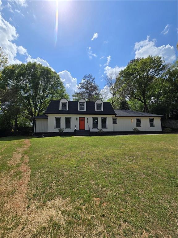 3832 Finger Creek Southwest Lilburn, GA 30047 - Photo 4 of 24 a front view of a house with a yard
