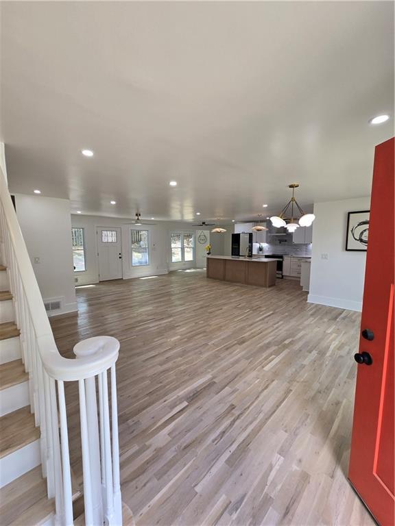 3832 Finger Creek Southwest Lilburn, GA 30047 - Photo 6 of 24 a living room with furniture and a wooden floor