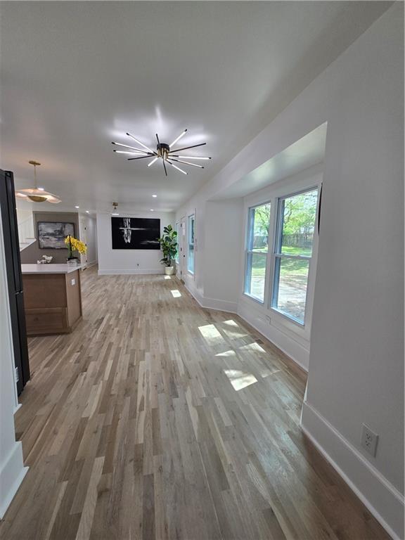 3832 Finger Creek Southwest Lilburn, GA 30047 - Photo 7 of 24 wooden floor in an empty room with a window