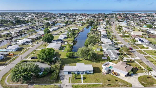 an aerial view of residential houses with outdoor space
