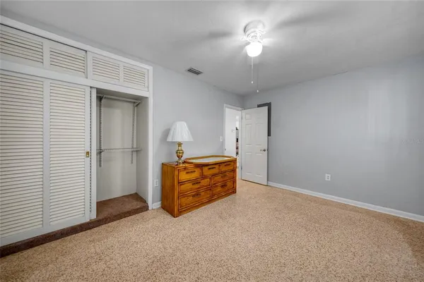 a bedroom with a bed and a cabinets
