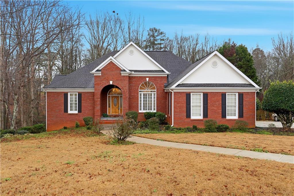 3051 Glenview Lane Monroe, GA 30656 - Photo 1 of 44 a front view of a house with a yard