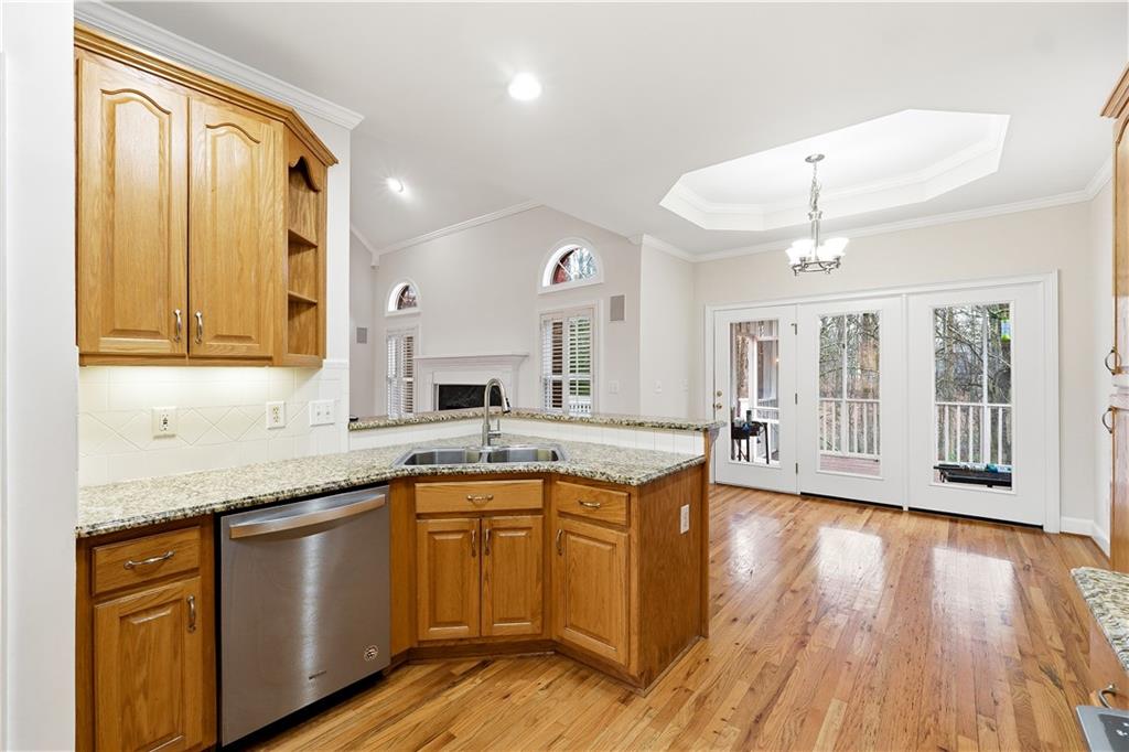 3051 Glenview Lane Monroe, GA 30656 - Photo 11 of 44 a large kitchen with a lot of counter space and wooden floor