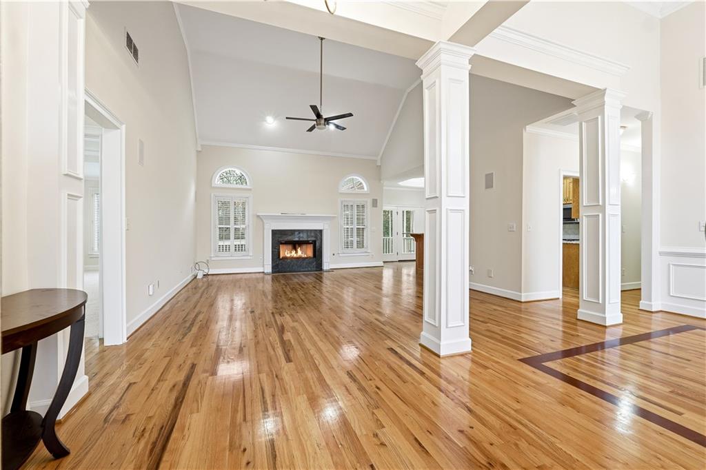 3051 Glenview Lane Monroe, GA 30656 - Photo 2 of 44 a view of empty room with a fireplace and wooden floor