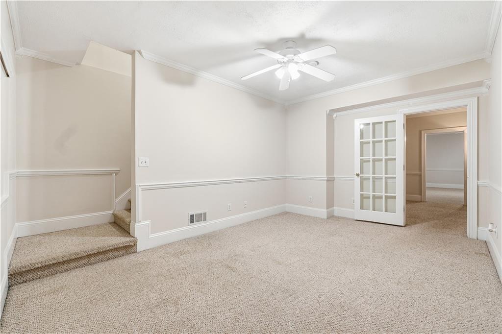 3051 Glenview Lane Monroe, GA 30656 - Photo 22 of 44 an empty room with chandelier fan