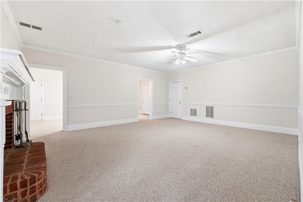 3051 Glenview Lane Monroe, GA 30656 - Photo 25 of 44 a view of a livingroom with a ceiling fan and window