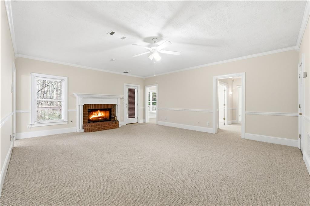 3051 Glenview Lane Monroe, GA 30656 - Photo 26 of 44 a view of an empty room with a fireplace and a window