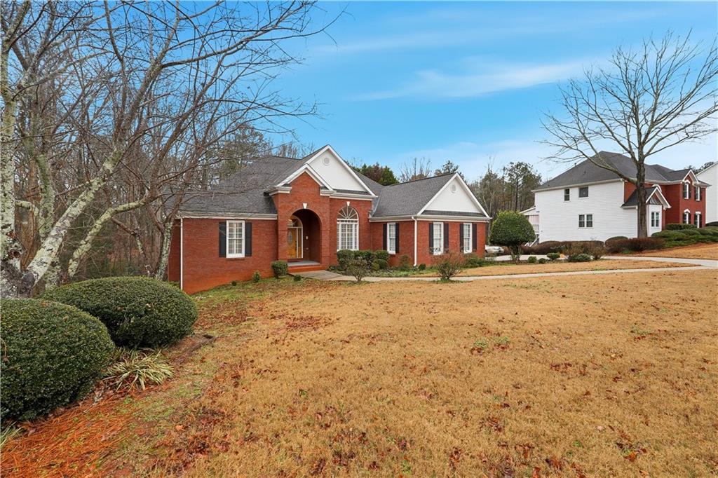 3051 Glenview Lane Monroe, GA 30656 - Photo 3 of 44 a front view of a house with a yard