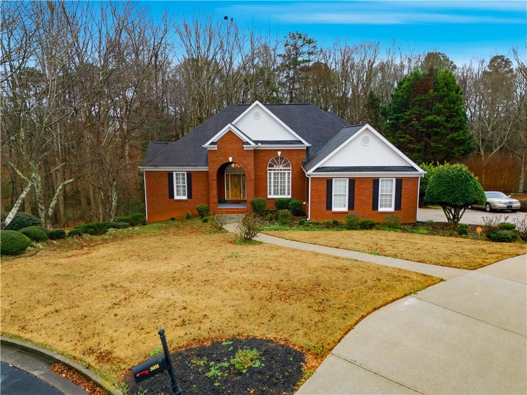 3051 Glenview Lane Monroe, GA 30656 - Photo 38 of 44 a front view of a house with yard and trees in the background