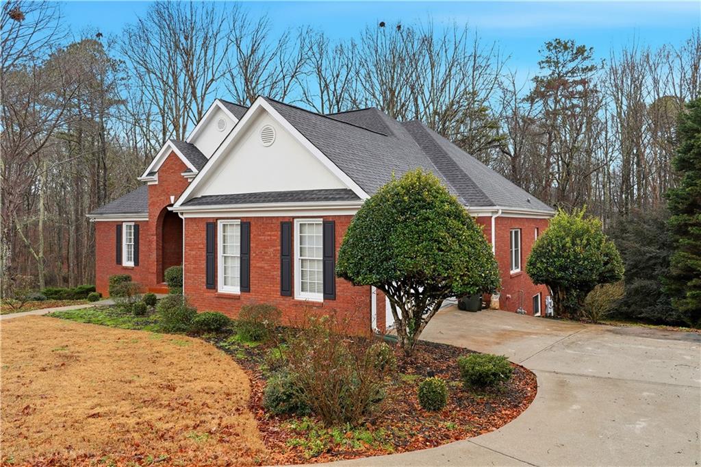 3051 Glenview Lane Monroe, GA 30656 - Photo 4 of 44 a front view of a house with garden