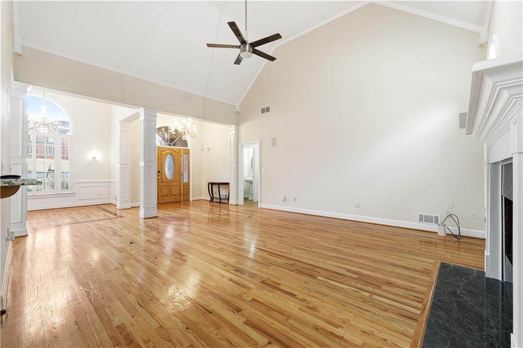 3051 Glenview Lane Monroe, GA 30656 - Photo 5 of 44 a view of a livingroom with wooden floor and a ceiling fan