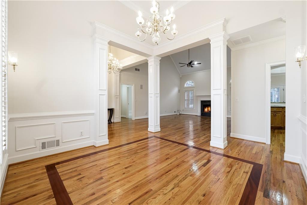 3051 Glenview Lane Monroe, GA 30656 - Photo 7 of 44 a view of a hallway with wooden floor and staircase