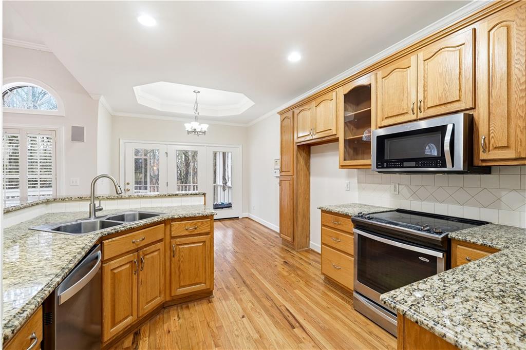 3051 Glenview Lane Monroe, GA 30656 - Photo 10 of 44 a kitchen with stainless steel appliances granite countertop a sink and microwave stove