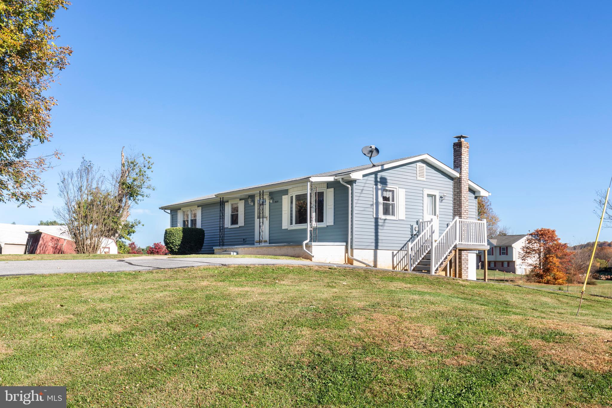 3830 Watson Lane Union Bridge, MD 21791 - Photo 35 of 37 a front view of house with yard and trees in the background