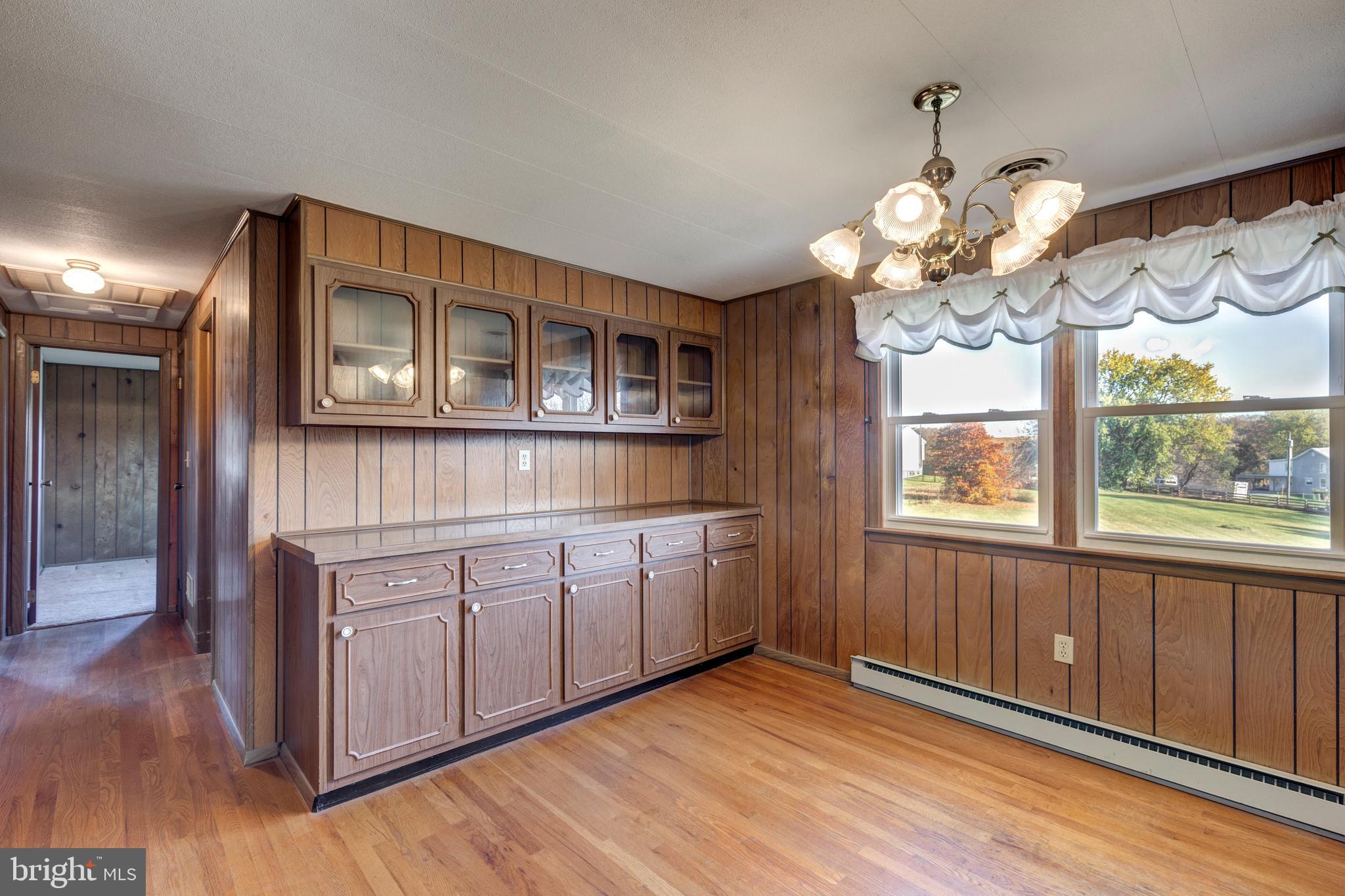 3830 Watson Lane Union Bridge, MD 21791 - Photo 8 of 37 a view of a kitchen with a sink dishwasher and wooden floor