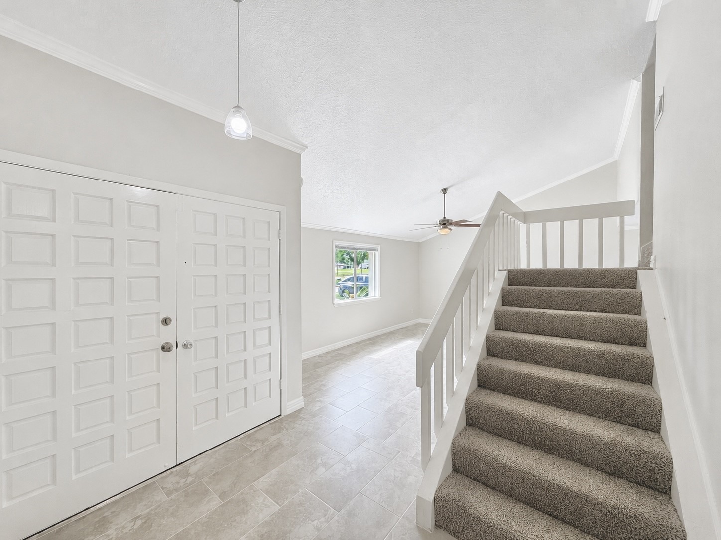 8407 Riverside Walk Lane Houston, TX 77064 - Photo 20 of 33 Welcoming entry features soaring ceilings, updated flooring, and abundant natural light, creating a bright first impression from the moment you walk in. Head upstairs and find all three bedrooms, updated bathrooms, and additional storage.