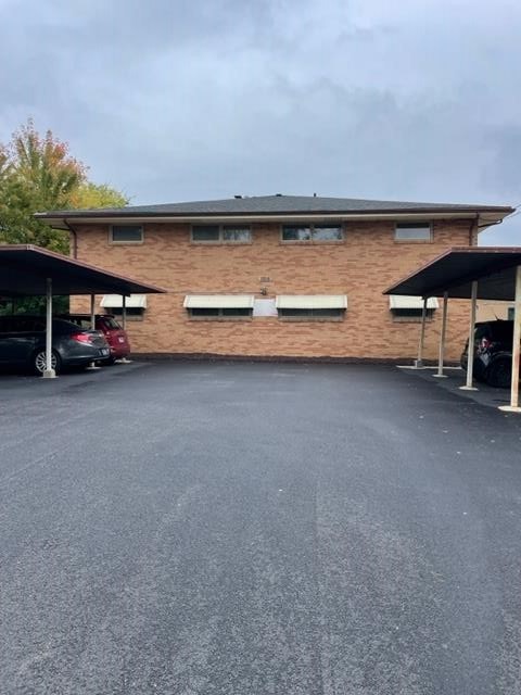 1806 Remington Road Rockford, IL 61108 - Photo 2 of 8 a view of an empty room with a fireplace