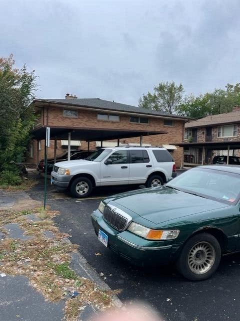 1806 Remington Road Rockford, IL 61108 - Photo 3 of 8 a view of a cars parked in garage
