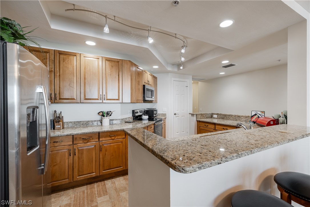 2743 First Street, Unit 1604 Fort Myers, FL 33916 - Photo 11 of 41 a kitchen with lots of counter space and window
