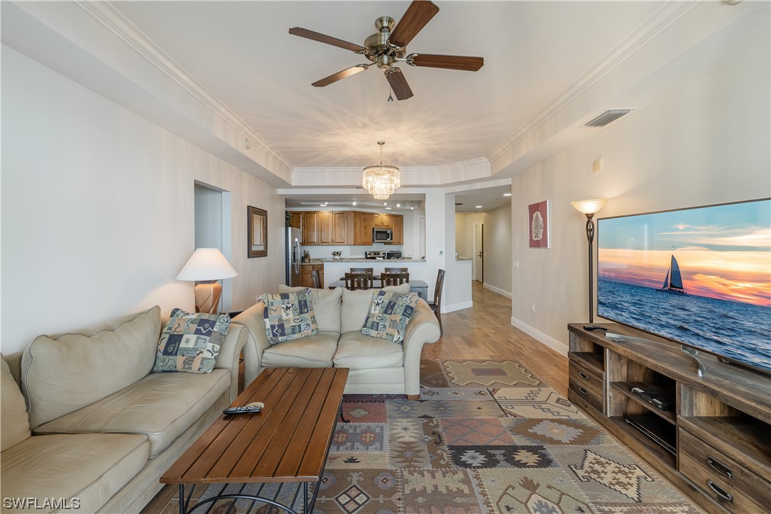 2743 First Street, Unit 1604 Fort Myers, FL 33916 - Photo 16 of 41 a living room with furniture and a flat screen tv