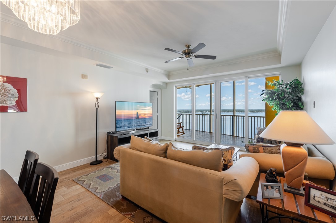 2743 First Street, Unit 1604 Fort Myers, FL 33916 - Photo 17 of 41 a living room with furniture ceiling fan and a window