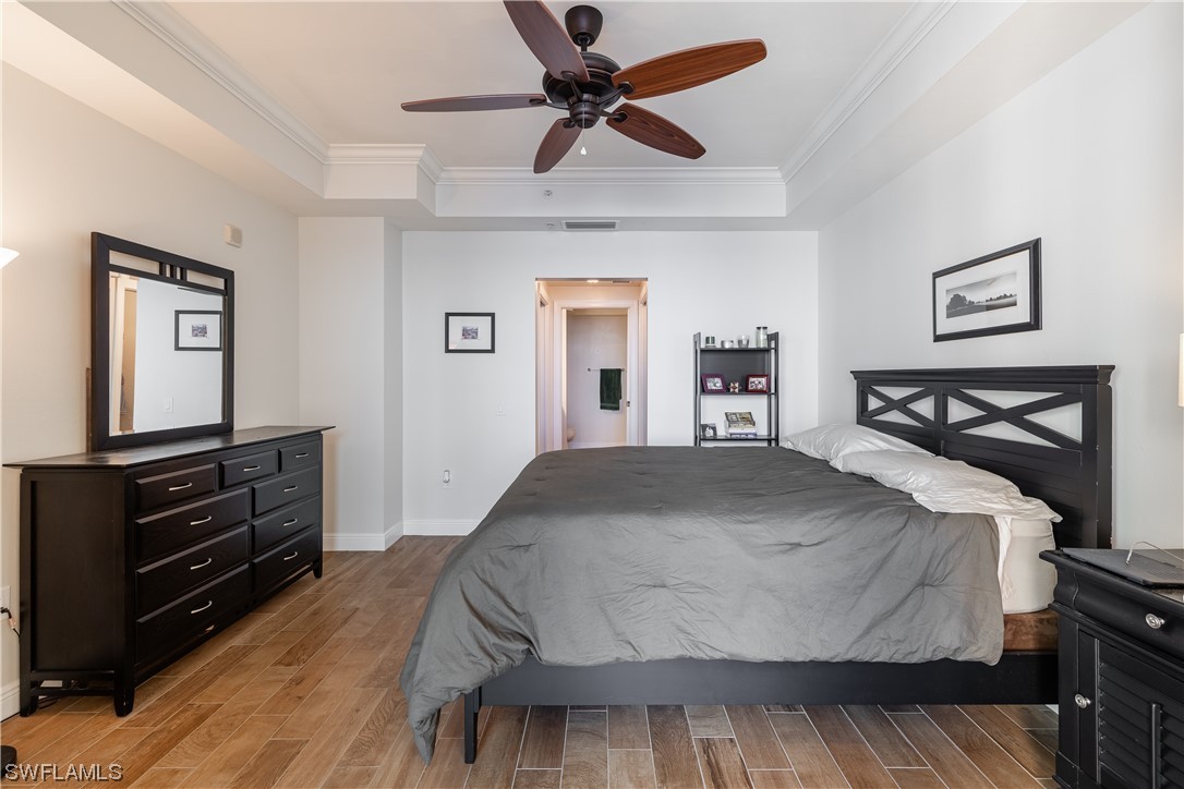 2743 First Street, Unit 1604 Fort Myers, FL 33916 - Photo 24 of 41 a bedroom with a bed and a dresser