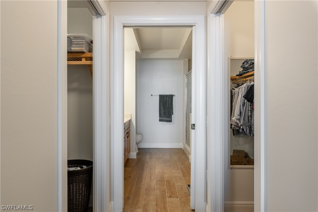2743 First Street, Unit 1604 Fort Myers, FL 33916 - Photo 26 of 41 a view of a hallway with wooden floor and closet