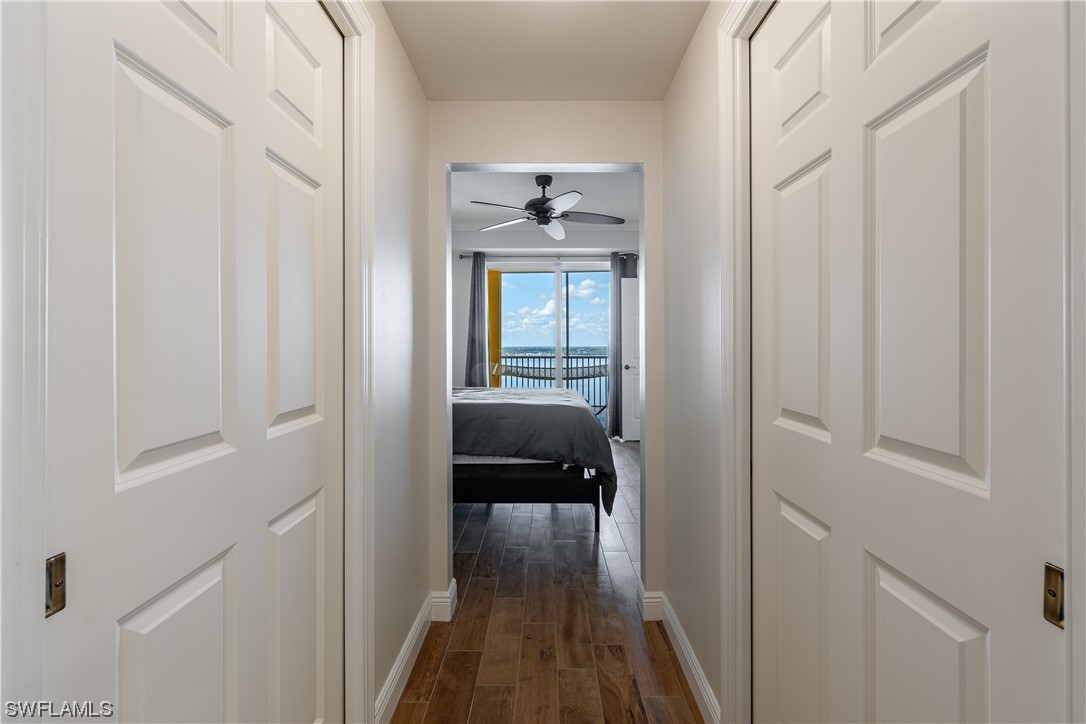 2743 First Street, Unit 1604 Fort Myers, FL 33916 - Photo 27 of 41 a view of a hallway with wooden floor and closet