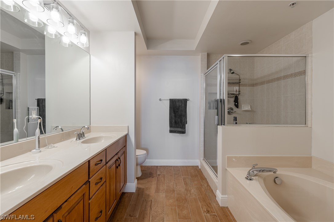 2743 First Street, Unit 1604 Fort Myers, FL 33916 - Photo 28 of 41 a bathroom with a tub sink and mirror