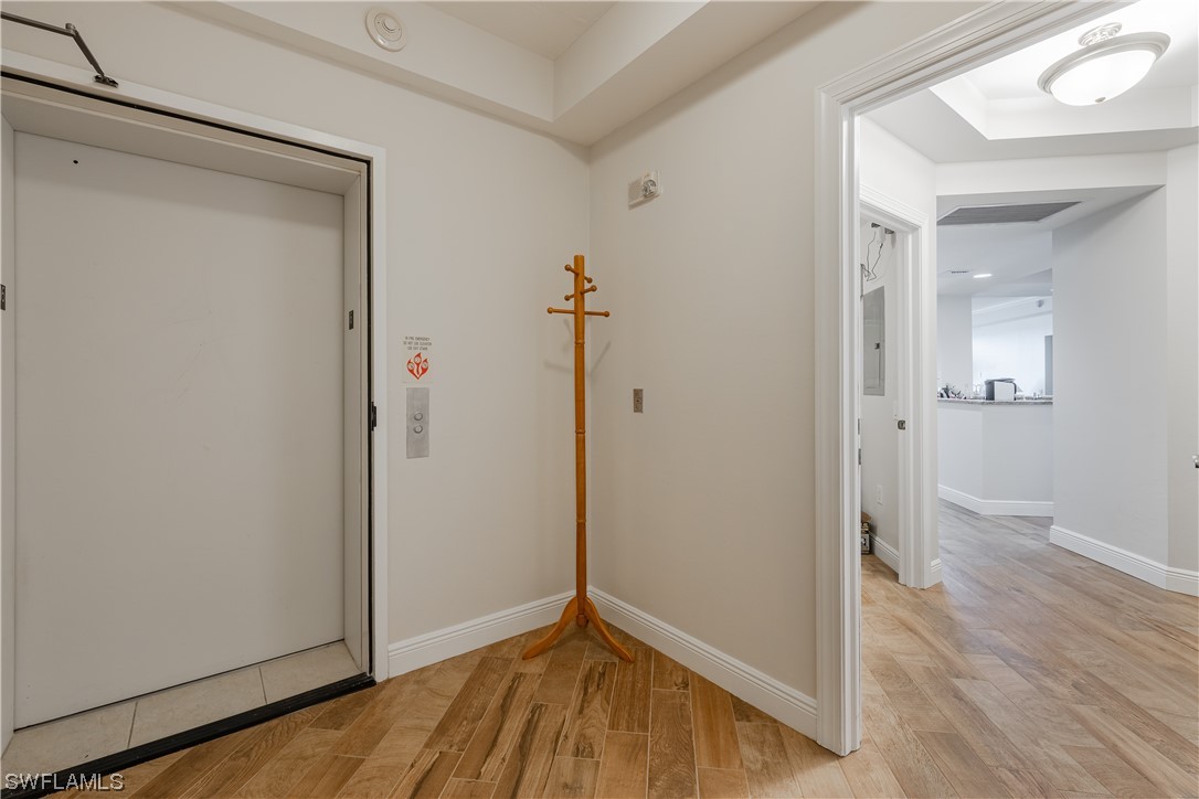 2743 First Street, Unit 1604 Fort Myers, FL 33916 - Photo 5 of 41 an empty room and wooden floor