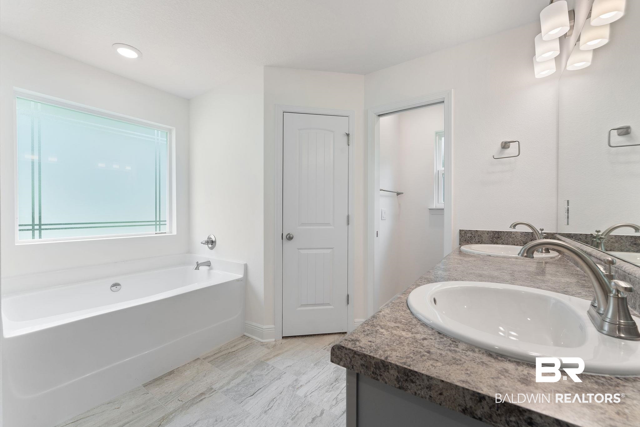 140 St Stephens Court Atmore, AL 36502 - Photo 7 of 14 Bathroom with vanity and a tub