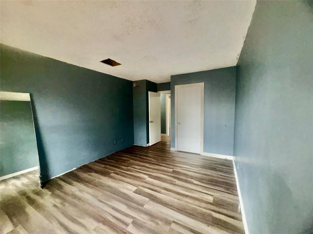 85 Place Fontaine Lithonia, GA 30038 - Photo 7 of 11 a view of empty room with wooden floor