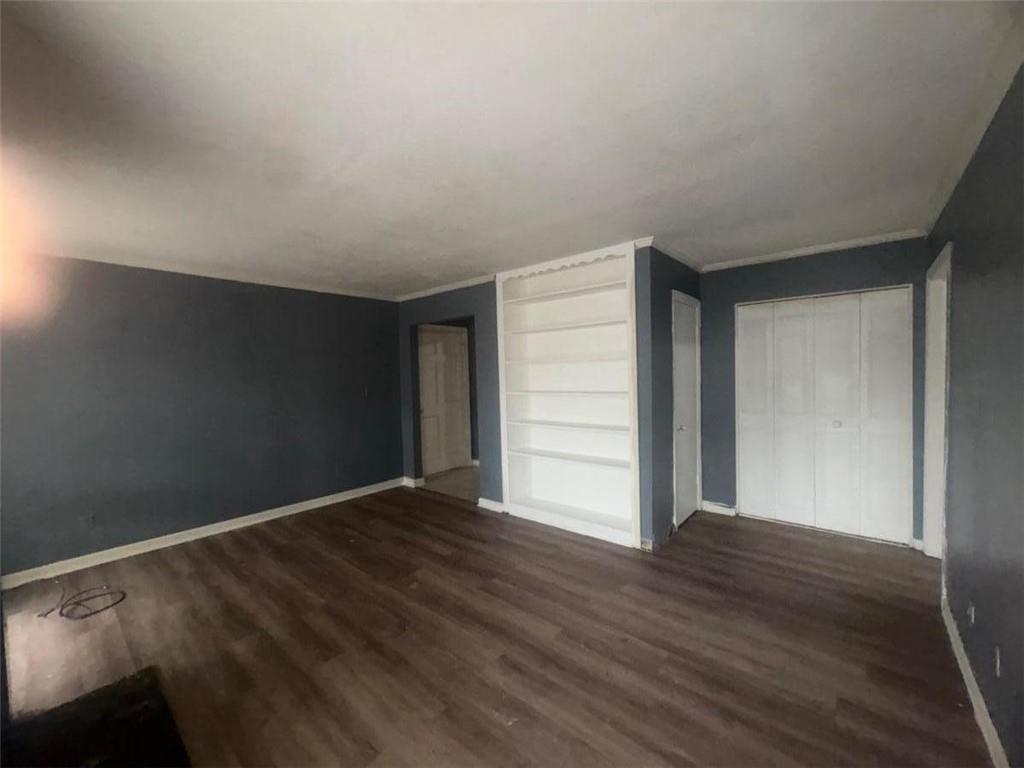 85 Place Fontaine Lithonia, GA 30038 - Photo 10 of 11 a view of an empty room with wooden floor
