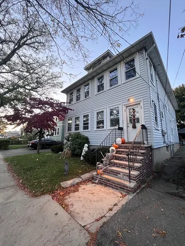 front view of a house with a yard