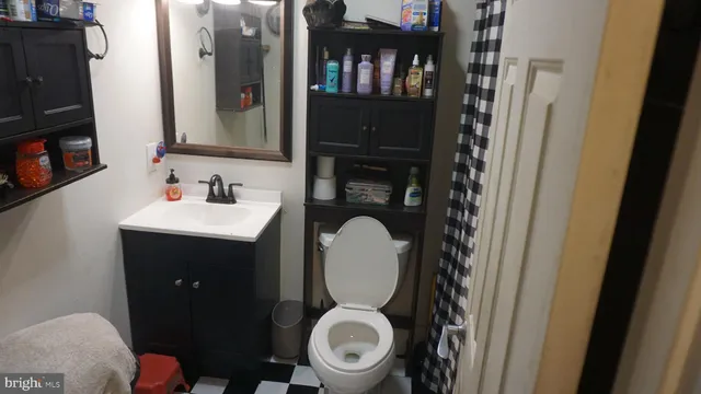 a bathroom with a toilet and a sink
