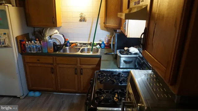 a kitchen with a stove and cabinets