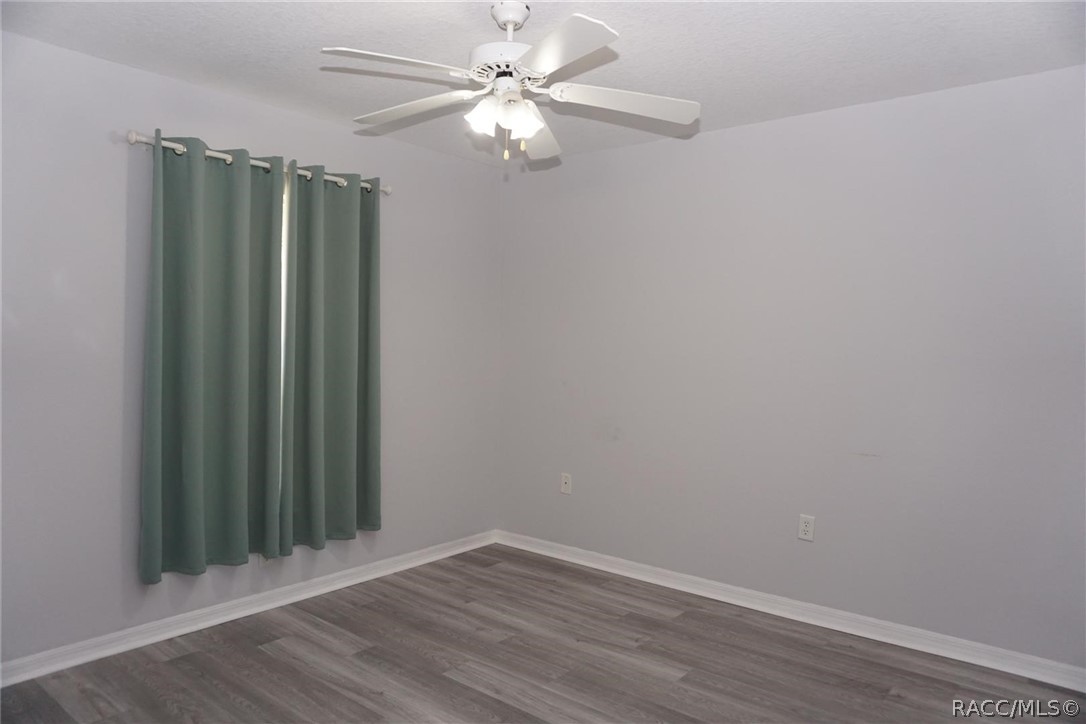 6079 East Penrose Street Inverness, FL 34452 - Photo 23 of 59 Bedroom 2 with new flooring