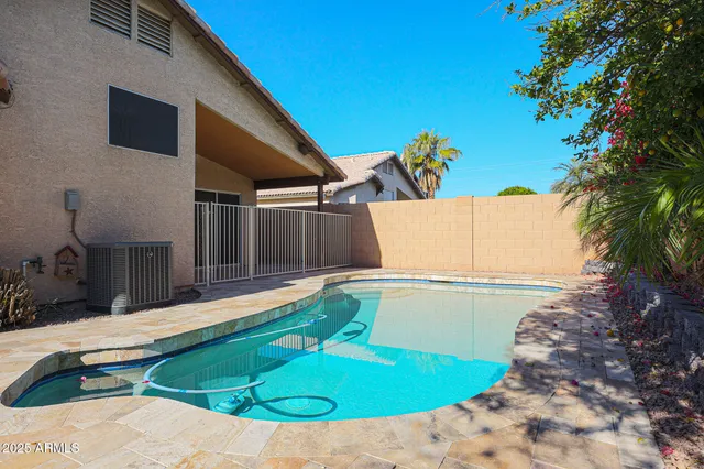 a view of a swimming pool with a patio
