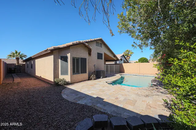 a house view with a backyard space