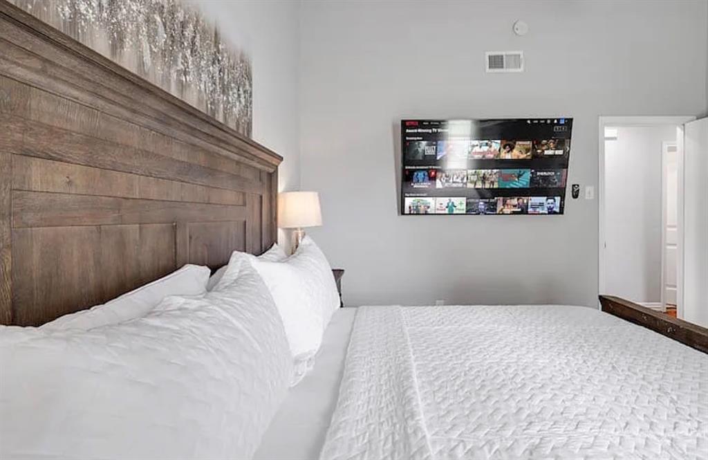 1718 Ripley Street Dallas, TX 75204 - Photo 22 of 33 Wood-finish headboard and bed frame