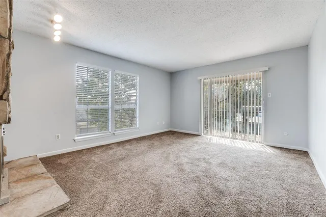 a view of a livingroom with entryway and a couch