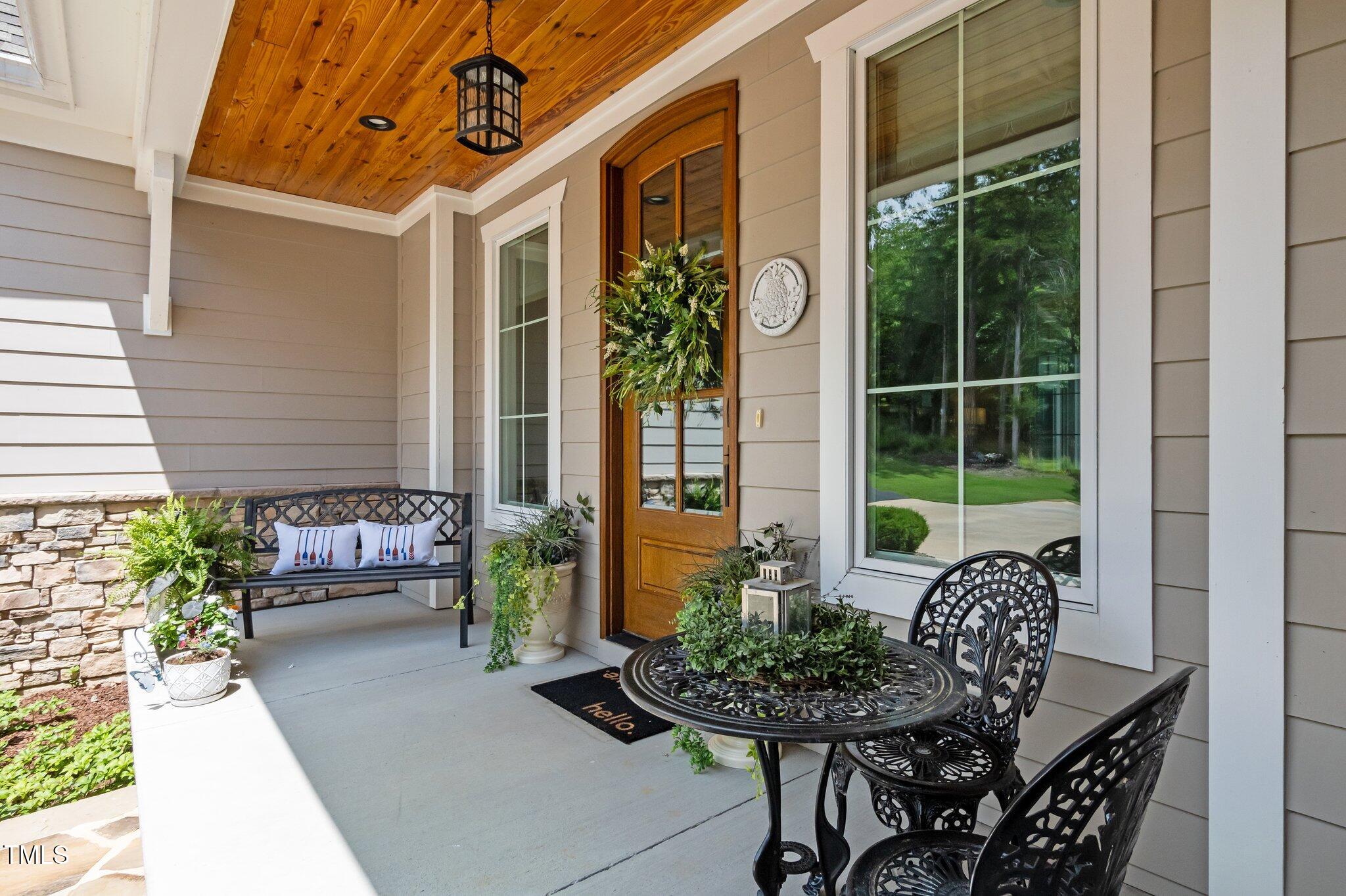 976 Estate Road Semora, NC 27343 - Photo 13 of 69 a outdoor living space with furniture and a potted plant