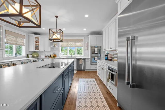 a bathroom with a sink and mirror with painted walls