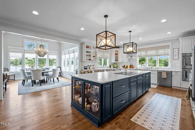 a living room with furniture and a book shelf