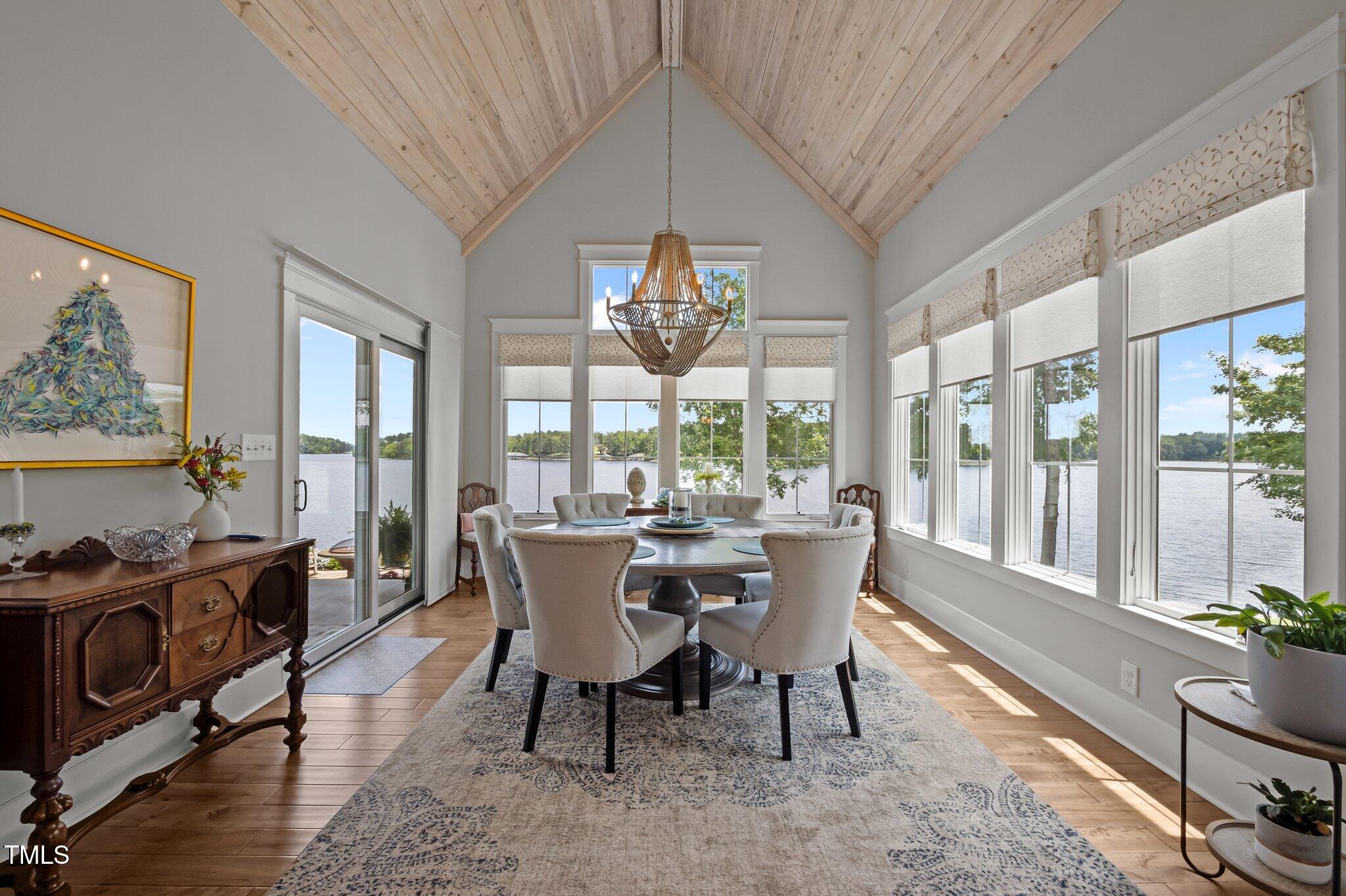 976 Estate Road Semora, NC 27343 - Photo 27 of 69 a view of a dining room with furniture a chandelier and wooden floor