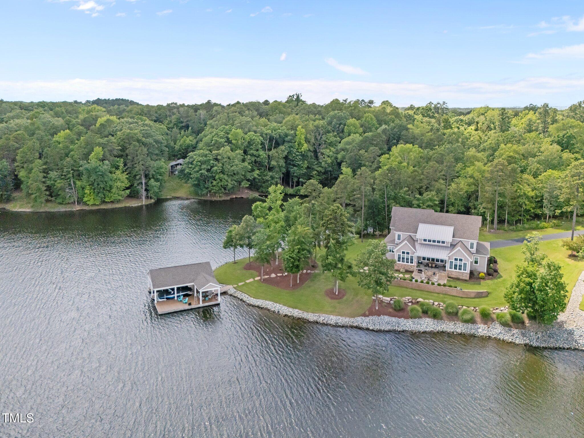 976 Estate Road Semora, NC 27343 - Photo 3 of 69 an aerial view of a house with a garden and a mountain view